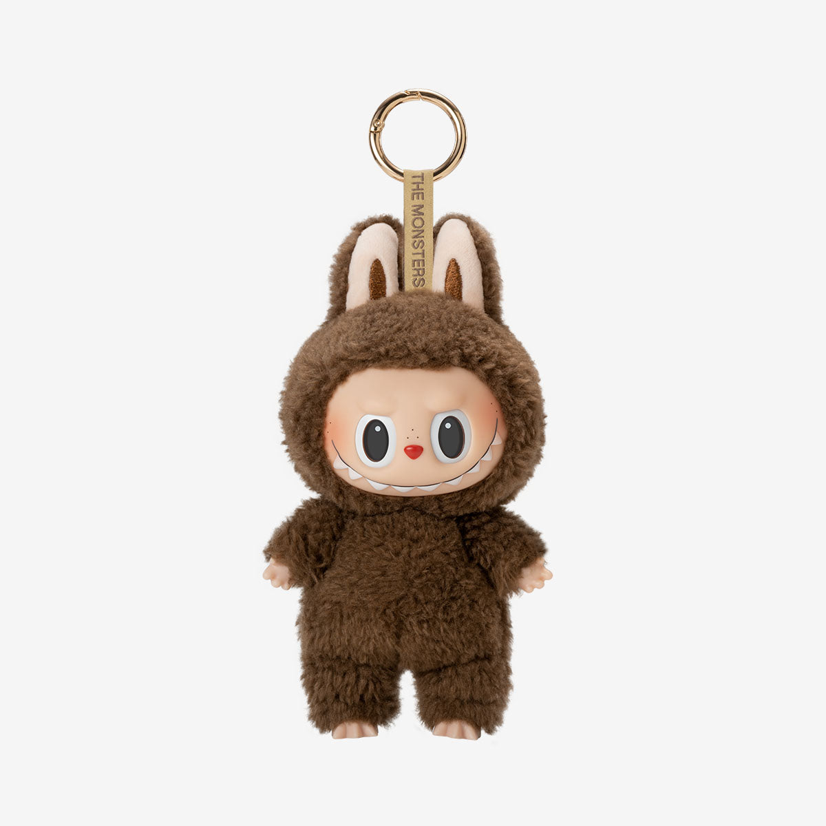 Brown plush keychain with a cute face on a beige background labubu toffee labubu exciting macarons labubu toy labubu toy labubu keychain labubu plush toy cute labubu