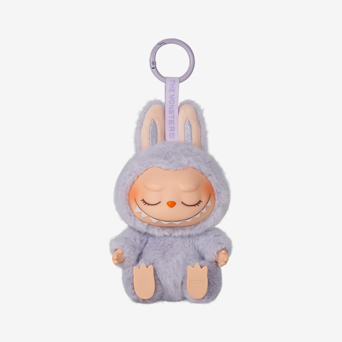 Plush toy with a purple outfit on a white background